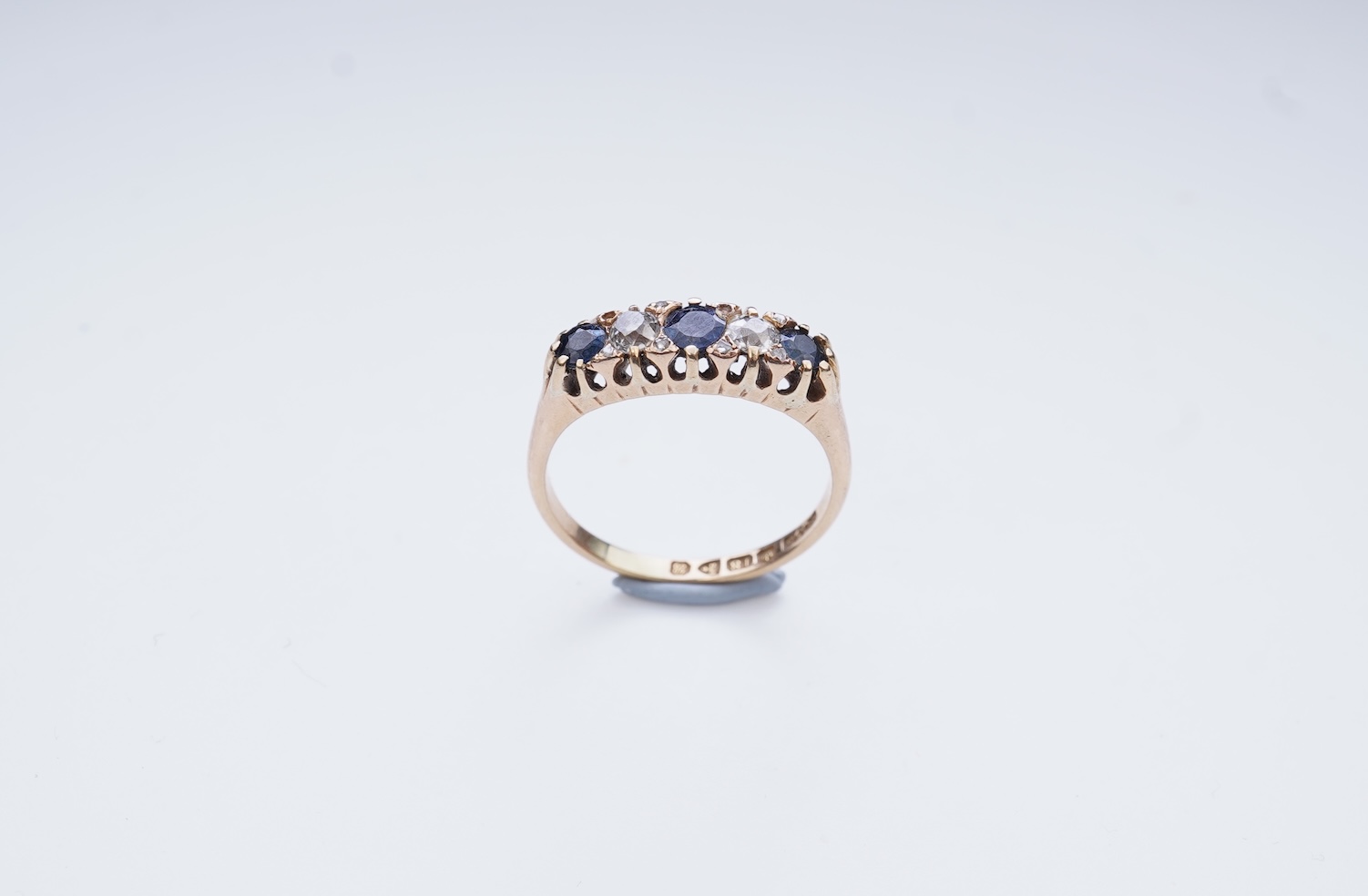 A sapphire and diamond five-stone ring, circa 1902